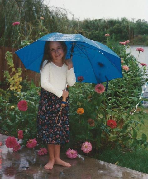 Jillian Playing in the Rain and Zinnias